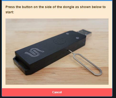 A black device with a silver handle  Description automatically generated